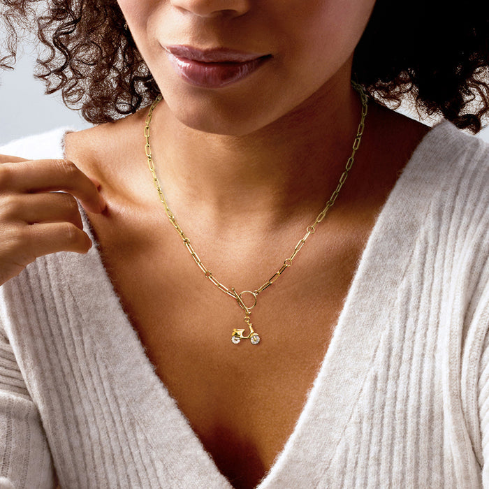 Scooter charm on a gold necklace chain with diamond-accented wheels