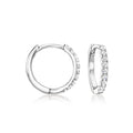 Sterling silver diamond huggie hoop earrings with pavé front and charm-compatible hinge