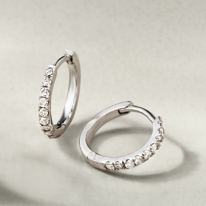 Diamond huggie hoop earrings in sterling silver