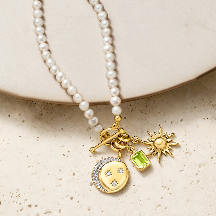 Pearl necklace with gold moon-and-stars charm pendant