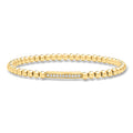 Gold bead stretch bracelet with diamond bar and small clear stones