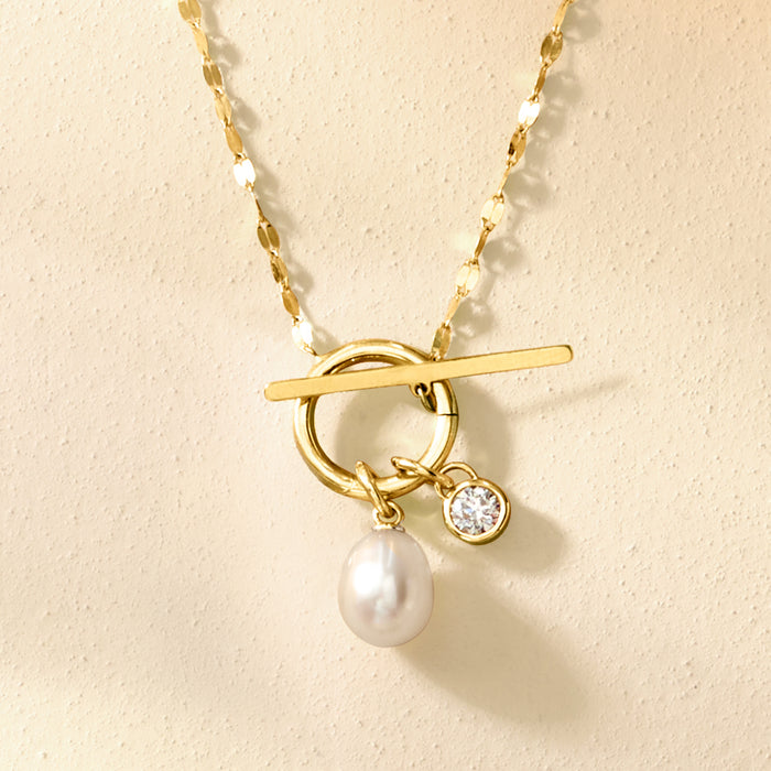 Yellow gold charm pendant with round diamond, bar accent, and pearl drop