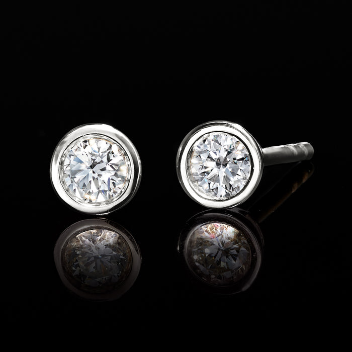 Round lab-grown diamond studs in bezel settings on sterling silver posts