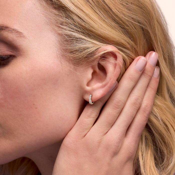Sterling silver lab-grown diamond hoop earring worn on ear