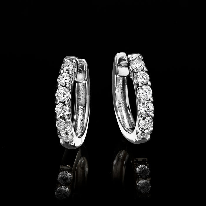 Sterling silver diamond hoop earrings, hinged clasp backs shown from the side