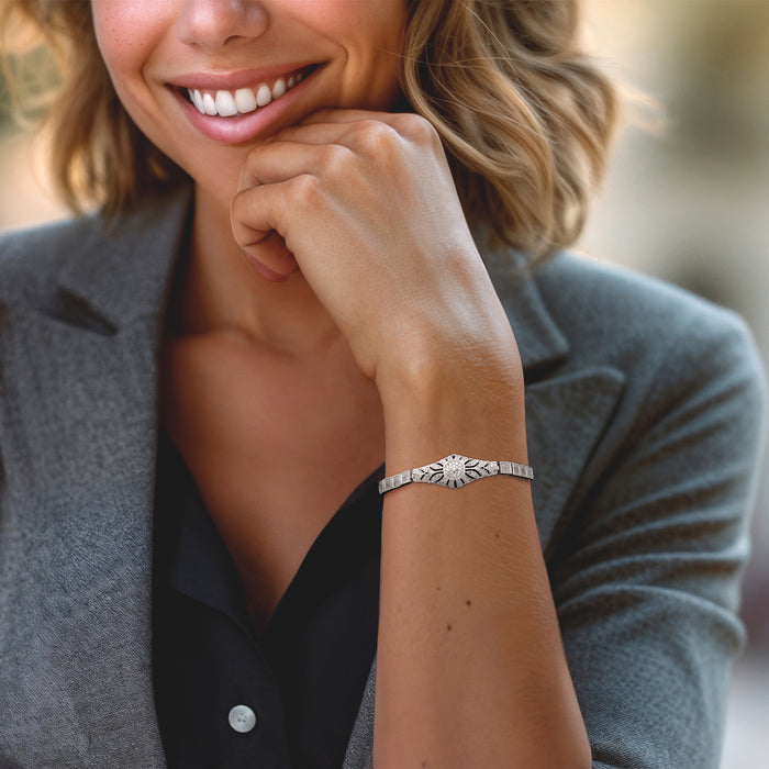 Sterling silver floral openwork bolo bracelet with diamond accents