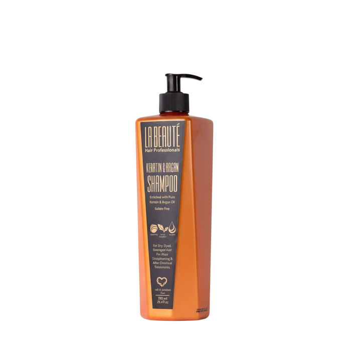 Orange shampoo bottle with black label on a white background